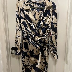 Beautiful collared cocktail dress.  Ties at waist. Unique, flattering.